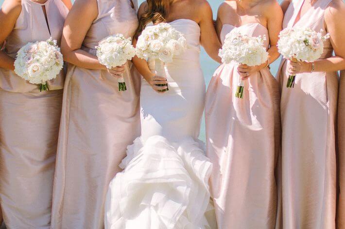 bridesmaids bride wearing blush bridesmaid dresses