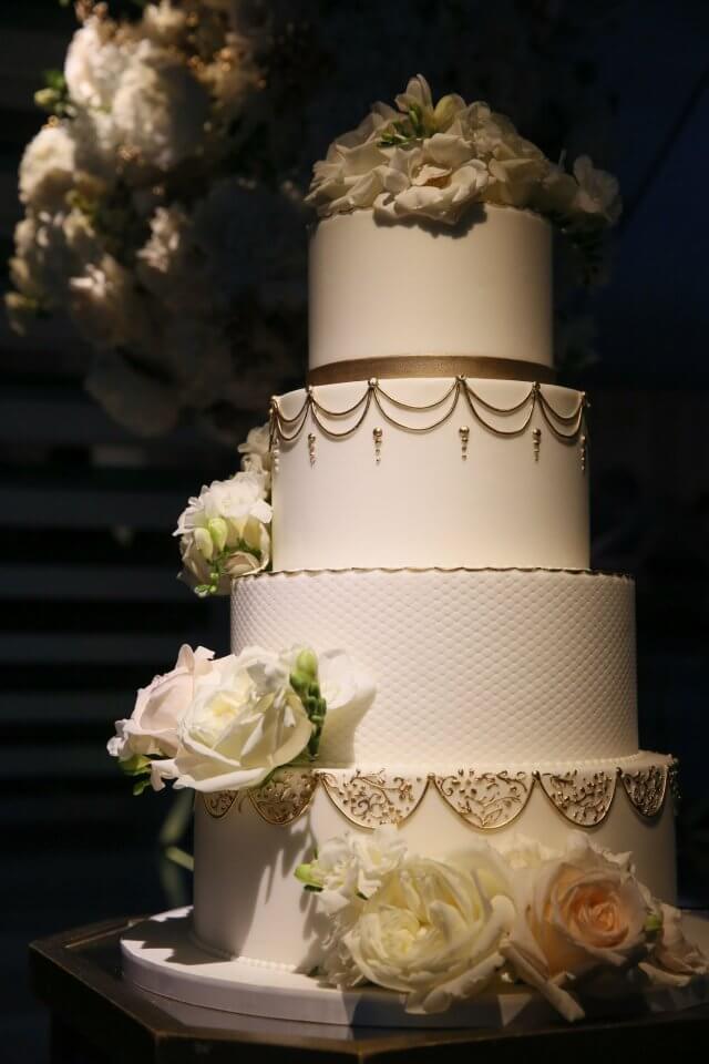 white and gold vintage wedding cake