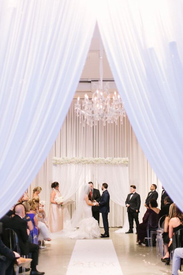 white ceremony draping at chez wedding ceremony