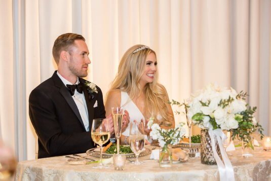 bride and groom at gold head table