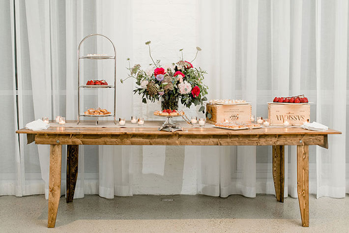 wooden sweets table at rustic wedding
