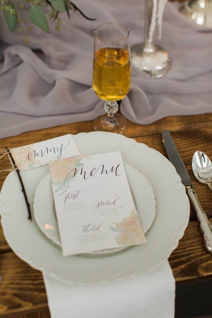 white southern style plate on wooden table with white and peach menu
