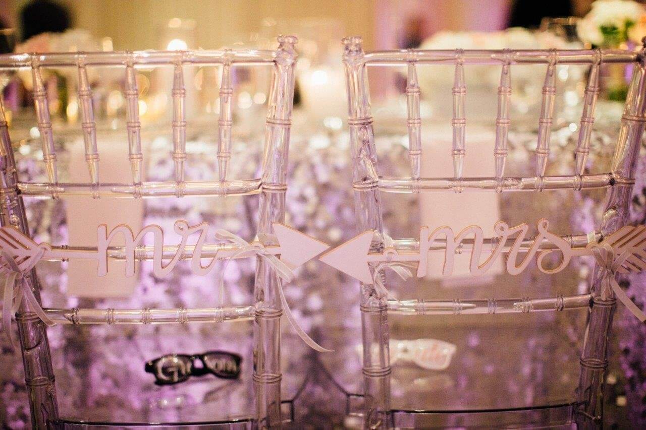 silver lucid chairs with mr and mrs signs