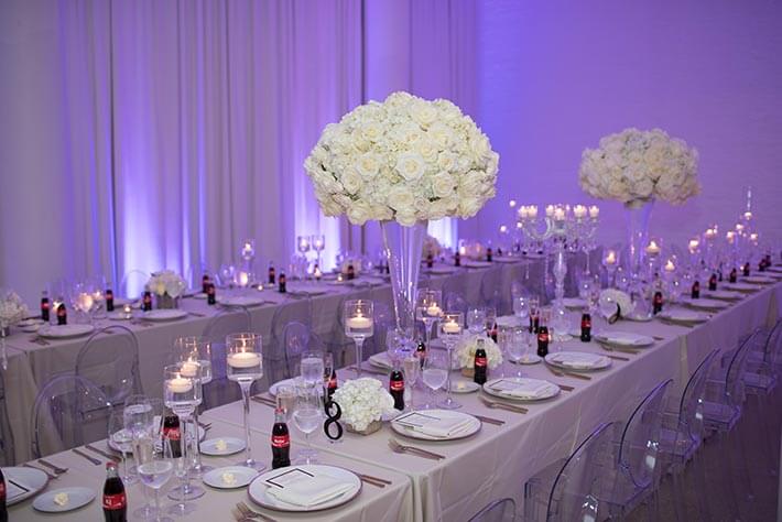 coke bottles on white tables at purple wedding reception