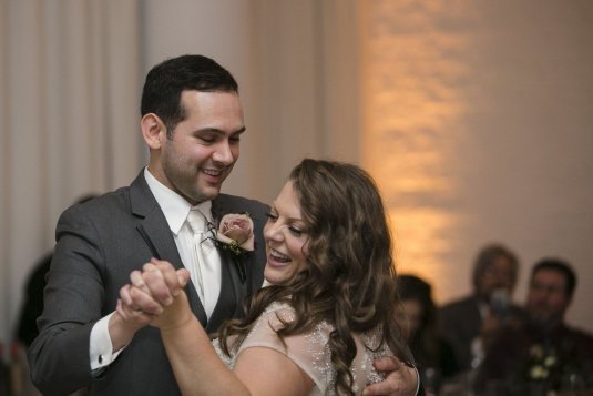 bride laughs and smiles during first dance