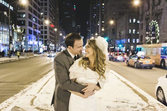bride and groom smile at each other outside in chicgao street