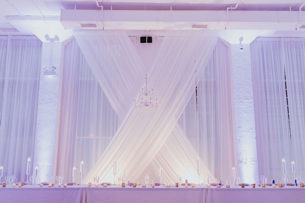 purple wedding reception head table at chez wedding venue