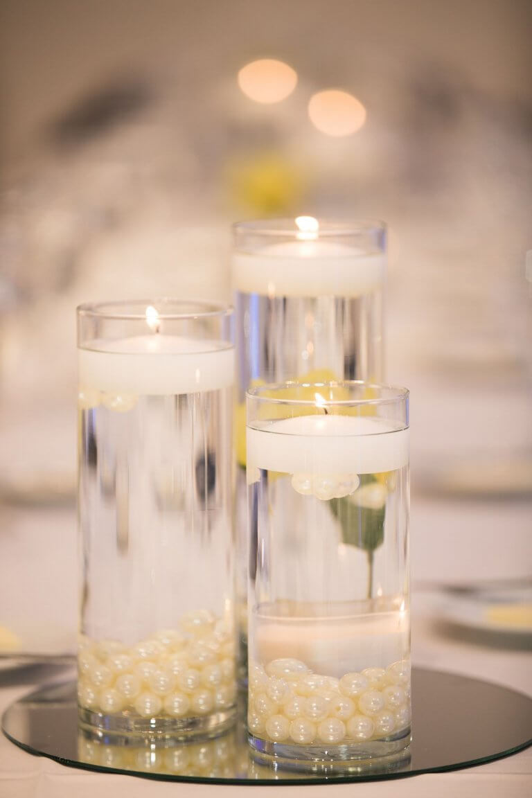 vases filled with water candles and pearls