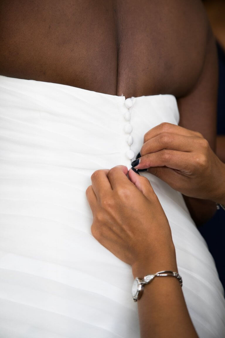 buttons on back of brides wedding dress