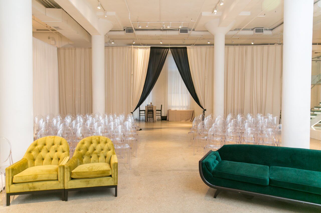 black and white draping with green and yellow ceremony seating