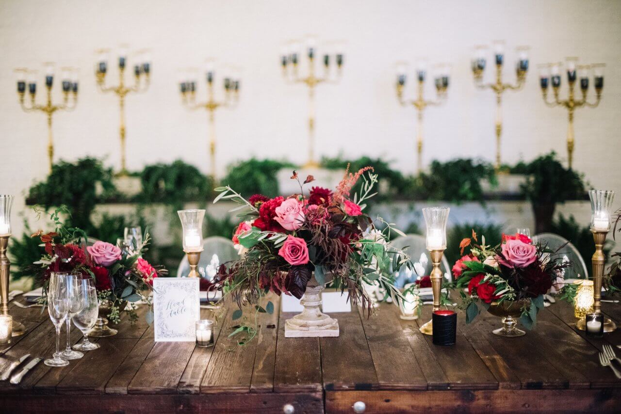 pink and burgundy florals on wooden table